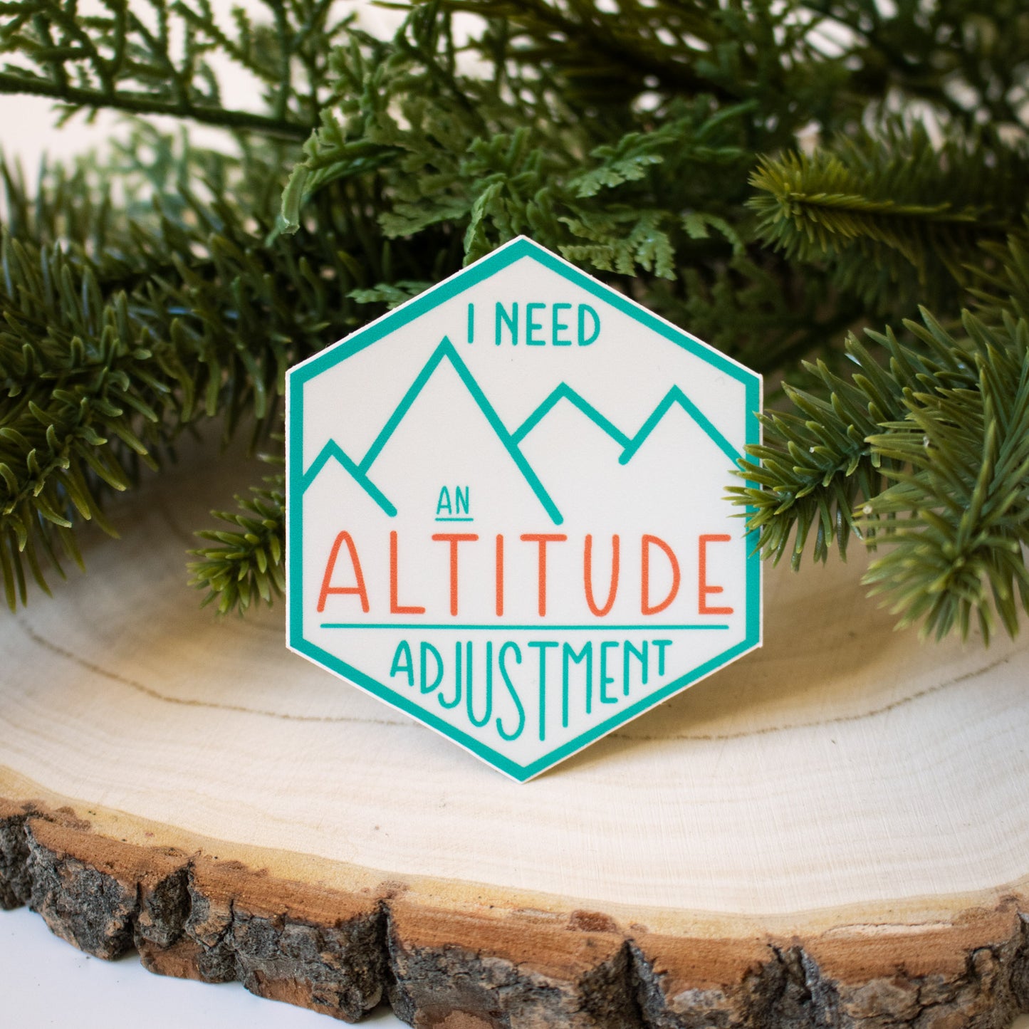 Simple line art mountain design with text "I need an altitude adjustment"  